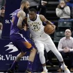 Indiana Pacers' Thaddeus Young (21) is defended by Phoenix Suns' Tyson Chandler during the second half of an NBA basketball game Wednesday, Jan. 24, 2018, in Indianapolis. The Pacers won 116-101. (AP Photo/Darron Cummings)