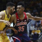 Arizona's Allonzo Trier (35) drives the ball against California's Nick Hamilton, left, in the second half of an NCAA college basketball game Wednesday, Jan. 17, 2018, in Berkeley, Calif. (AP Photo/Ben Margot)