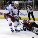 New York Rangers center Kevin Hayes (13) collects a rebound from Arizona Coyotes goaltender Antti Raanta in the first period during an NHL hockey game, Saturday, Jan. 6, 2018, in Glendale, Ariz. (AP Photo/Rick Scuteri)