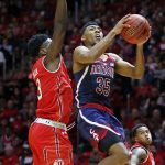 Arizona guard Allonzo Trier (35) goes to the basket as Utah forward Donnie Tillman (3) defends in the first half during an NCAA college basketball game Thursday, Jan. 4, 2018, in Salt Lake City. (AP Photo/Rick Bowmer)