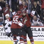 Arizona Coyotes center Brad Richardson celebrates with Jason Demers (55) after scoring a goal in the third period during an NHL hockey game, Tuesday, Jan. 16, 2018, in Glendale, Ariz. San Jose defeated Arizona 3-2 in an overtime shootout. (AP Photo/Rick Scuteri)