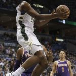 Milwaukee Bucks forward Khris Middleton goes up for a basket against the Phoenix Suns during the first half of an NBA basketball game Monday, Jan. 22, 2018, in Milwaukee. (AP Photo/Darren Hauck)