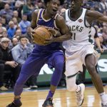 Phoenix Suns forward Josh Jackson, left, is defended by Milwaukee Bucks guard Tony Snell, right, during the second half of an NBA basketball game Monday, Jan. 22, 2018, in Milwaukee. (AP Photo/Darren Hauck)