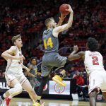 Arizona State guard Kodi Justice (44) goes to the basket as Utah's Jayce Johnson, left, and Kolbe Caldwell (2) defend in the first half of an NCAA college basketball game Sunday, Jan. 7, 2018, in Salt Lake City. (AP Photo/Rick Bowmer)