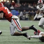 Alabama's Anthony Averett trips up Georgia running back Nick Chubb for a loss during the second half of the NCAA college football playoff championship game Monday, Jan. 8, 2018, in Atlanta. (AP Photo/David J. Phillip)