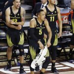 Oregon forward Paul White (13), guard Elijah Brown (5) and forward Keith Smith (11) celebrate a score against Arizona State during the second half of an NCAA college basketball game Thursday, Jan. 11, 2018, in Tempe, Ariz. Oregon defeated Arizona State 76-72. (AP Photo/Ross D. Franklin)