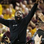 Former Arizona State basketball player and current Houston Rockets NBA player James Harden cheers along with the crowd during the first half of an NCAA college basketball game against Oregon, Thursday, Jan. 11, 2018, in Tempe, Ariz. (AP Photo/Ross D. Franklin)