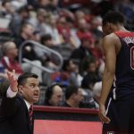 Arizona coach Sean Miller, left, speaks with guard Parker Jackson-Cartwright during the first half of the team's NCAA college basketball game against Washington State in Pullman, Wash., Wednesday, Jan. 31, 2018. (AP Photo/Young Kwak)