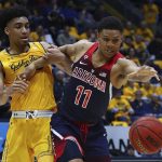 California's Justice Sueing, left, keeps Arizona's Ira Lee (11) from the ball in the second half of an NCAA college basketball game Wednesday, Jan. 17, 2018, in Berkeley, Calif. (AP Photo/Ben Margot)