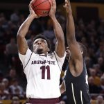 Arizona State guard Shannon Evans II (11) shoots as Colorado guard McKinley Wright IV defends during the second half of an NCAA college basketball game, Saturday, Jan. 27, 2018, in Tempe, Ariz.  (AP Photo/Matt York)