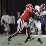 Alabama's Bo Scarbrough catches a pass in front of Georgia's Roquan Smiths during the second half of the NCAA college football playoff championship game Monday, Jan. 8, 2018, in Atlanta. (AP Photo/David J. Phillip)