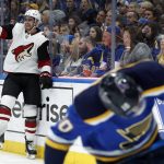 Arizona Coyotes' Brendan Perlini, left, celebrates after scoring as St. Louis Blues' Brayden Schenn, right, skates past during the first period of an NHL hockey game Saturday, Jan. 20, 2018, in St. Louis. (AP Photo/Jeff Roberson)