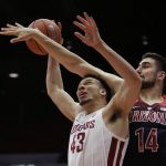 Washington State forward Drick Bernstine (43) is fouled on the way to the basket by Arizona center Dusan Ristic (14) during the first half of an NCAA college basketball game in Pullman, Wash., Wednesday, Jan. 31, 2018. (AP Photo/Young Kwak)