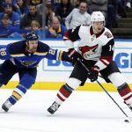 Arizona Coyotes' Richard Panik, of Slovakia, controls the puck as St. Louis Blues' Kyle Brodziak (28) defends during the third period of an NHL hockey game Saturday, Jan. 20, 2018, in St. Louis. (AP Photo/Jeff Roberson)