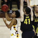 Arizona State guard Tra Holder, left, drives past Oregon forward Roman Sorkin (41) and forward Paul White (13) during the second half of an NCAA college basketball game Thursday, Jan. 11, 2018, in Tempe, Ariz. Oregon defeated Arizona State 76-72. (AP Photo/Ross D. Franklin)