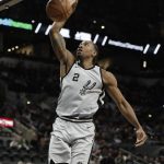 San Antonio Spurs forward Kawhi Leonard scores against the Phoenix Suns during the first half of an NBA basketball game Friday, Jan. 5, 2018, in San Antonio. (AP Photo/Eric Gay)