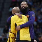 Phoenix Suns center Tyson Chandler, back, jokes with Denver Nuggets forward Richard Jefferson as the teams warm up before the first half of an NBA basketball game Wednesday, Jan. 3, 2018, in Denver. (AP Photo/David Zalubowski)