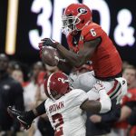 Alabama's Tony Brown intercepts a pass intended for Georgia's Javon Wims during the first half of the NCAA college football playoff championship game Monday, Jan. 8, 2018, in Atlanta. (AP Photo/David J. Phillip)
