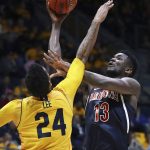 Arizona's Deandre Ayton, right, shoots over California's Marcus Lee (24) in the second half of an NCAA college basketball game Wednesday, Jan. 17, 2018, in Berkeley, Calif. (AP Photo/Ben Margot)