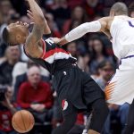 Portland Trail Blazers guard Damian Lillard, left, is pushed by Phoenix Suns center Tyson Chandler during the first half of an NBA basketball game in Portland, Ore., Tuesday, Jan. 16, 2018. (AP Photo/Craig Mitchelldyer)