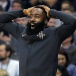 Houston Rockets guard James Harden reacts from the bench to a teammate's dunk against the Phoenix Suns during the second half of an NBA basketball game Friday, Jan. 12, 2018, in Phoenix. (AP Photo/Matt York)