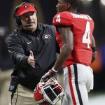 Georgia head coach Kirby Smart congratulates Mecole Hardman after a touchdown run during the first half of the NCAA college football playoff championship game against Alabama Monday, Jan. 8, 2018, in Atlanta. (AP Photo/David Goldman)