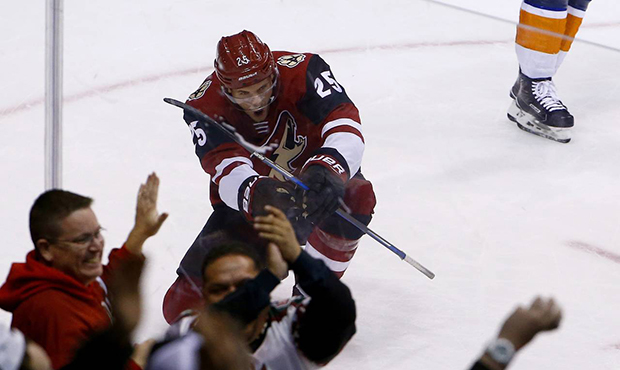 Arizona Coyotes center Nick Cousins celebrates his goal against the New York Islanders during overt...