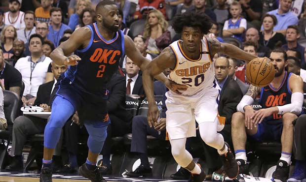 Phoenix Suns forward Josh Jackson (20) drives on Oklahoma City Thunder guard Raymond Felton in the ...