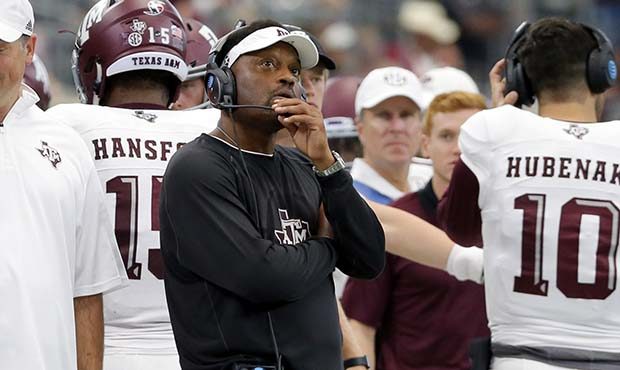 Texas A&M head coach Kevin Sumlin stands on the sideline during an NCAA college football game a...
