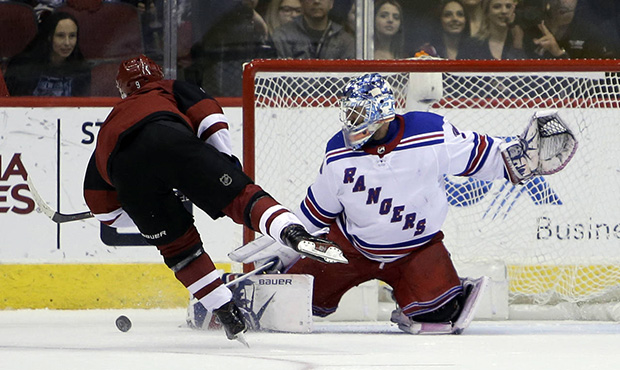 New York Rangers goaltender Henrik Lundqvist (30) makes a save against Arizona Coyotes center Clayt...