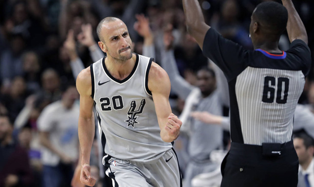 San Antonio Spurs guard Manu Ginobili (20) clenches his fist after scoring against the Phoenix Suns...
