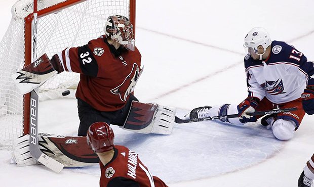 Columbus Blue Jackets right wing Cam Atkinson (13) scores against Arizona Coyotes goaltender Antti ...