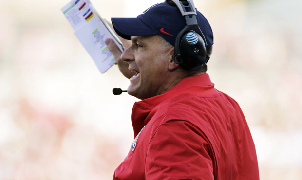 Arizona head coach Rich Rodriguez directs his team during the first half of an NCAA college footbal...