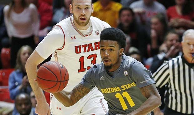 Arizona State guard Shannon Evans II (11) brings the ball up court as Utah forward David Collette (...