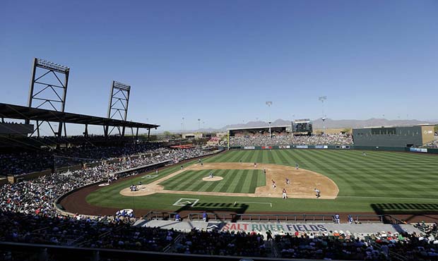 Fans at Salt River Fields at Talking Stick watch a spring training baseball game between the Arizon...