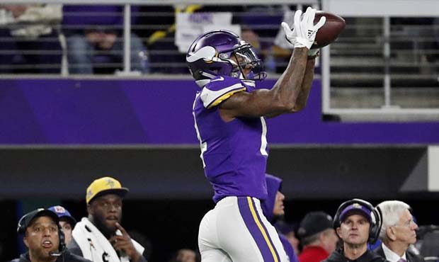 Minnesota Vikings wide receiver Stefon Riggs (14) makes a catch over New Orleans Saints free safety...