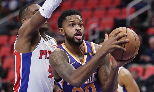 Phoenix Suns guard Troy Daniels (30) goes to the basket past Detroit Pistons guard Langston Gallowa...