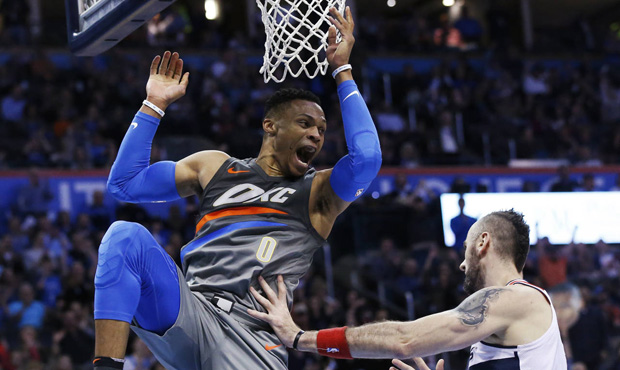 Oklahoma City Thunder guard Russell Westbrook (0) celebrates a dunk in front of Washington Wizards ...