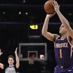 Phoenix Suns' Devin Booker shoots during the NBA basketball All-Star weekend 3-Point contest, Saturday, Feb. 17, 2018, in Los Angeles. Booker won the event. (AP Photo/Chris Pizzello)