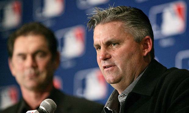 FILE - In this Dec. 7, 2005, file photo, San Diego Padres general manager Kevin Towers, right, peak...