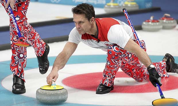 Norway's skip Thomas Ulsrud prepares to launch the stone during their men's curling match against U...