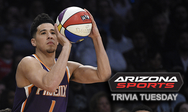 Phoenix Suns' Devin Booker shoots during the NBA basketball All-Star weekend 3-point contest Saturd...