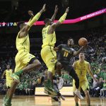 Arizona State's Shannon Evans II, center, shots under pressure from Oregon's Kenny Wooten, left, MiKyle McIntosh and Payton Pritchard, right, during the second half of an NCAA college basketball game Thursday Feb. 22, 2018, in Eugene, Ore. (AP photo/Chris Pietsch)