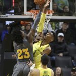 Arizona State's Romello White, left, has his shot blocked by Oregon's Kenny Wooten, with Oregon's Paul White, foreground right, watching during the first half of an NCAA college basketball game Thursday, Feb. 22, 2018, in Eugene, Ore. (AP Photo/Chris Pietsch)
