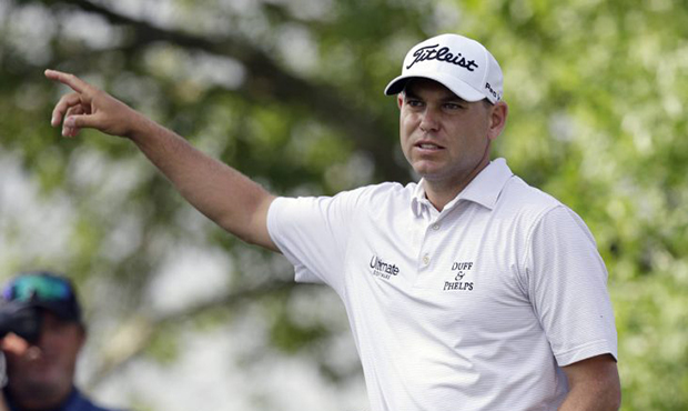 Bill Haas signals the direction of his drive on the sixth hole during semifinal play at the Dell Te...
