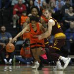 Oregon State's Stephen Thompson Jr., center, protects the ball from Arizona State's Kimani Lawrence, rear, and Kodi Justice, right, in the first half of an NCAA college basketball game in Corvallis, Ore., Saturday, Feb. 24, 2018. (AP Photo/Timothy J. Gonzalez)