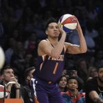 Phoenix Suns' Devin Booker shoots during the NBA basketball All-Star weekend 3-point contest Saturday, Feb. 17, 2018, in Los Angeles. Booker won the event. (AP Photo/Chris Pizzello)