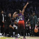 Utah Jazz's Donovan Mitchell gestures after dunking during the NBA All-Star basketball Slam Dunk contest, Saturday, Feb. 17, 2018, in Los Angeles. Mitchell won the event. (AP Photo/Chris Pizzello)