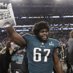 Philadelphia Eagles offensive guard Chance Warmack (67) holds up a newspaper after winning the NFL Super Bowl 52 football game against the New England Patriots, Sunday, Feb. 4, 2018, in Minneapolis. The Eagles won 41-33. (AP Photo/Tony Gutierrez)