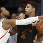 Arizona guard Parker Jackson-Cartwright (0) defends against Southern California guard Derryck Thornton (5) during the first half of an NCAA college basketball game Saturday, Feb. 10, 2018, in Tucson, Ariz. (Kelly Presnell/Arizona Daily Star via AP)